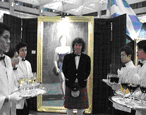 Charles awaits the guests at his Exhibition at The Landmark in Hong Kong with Silver Service Catering by Maxim's of Paris .